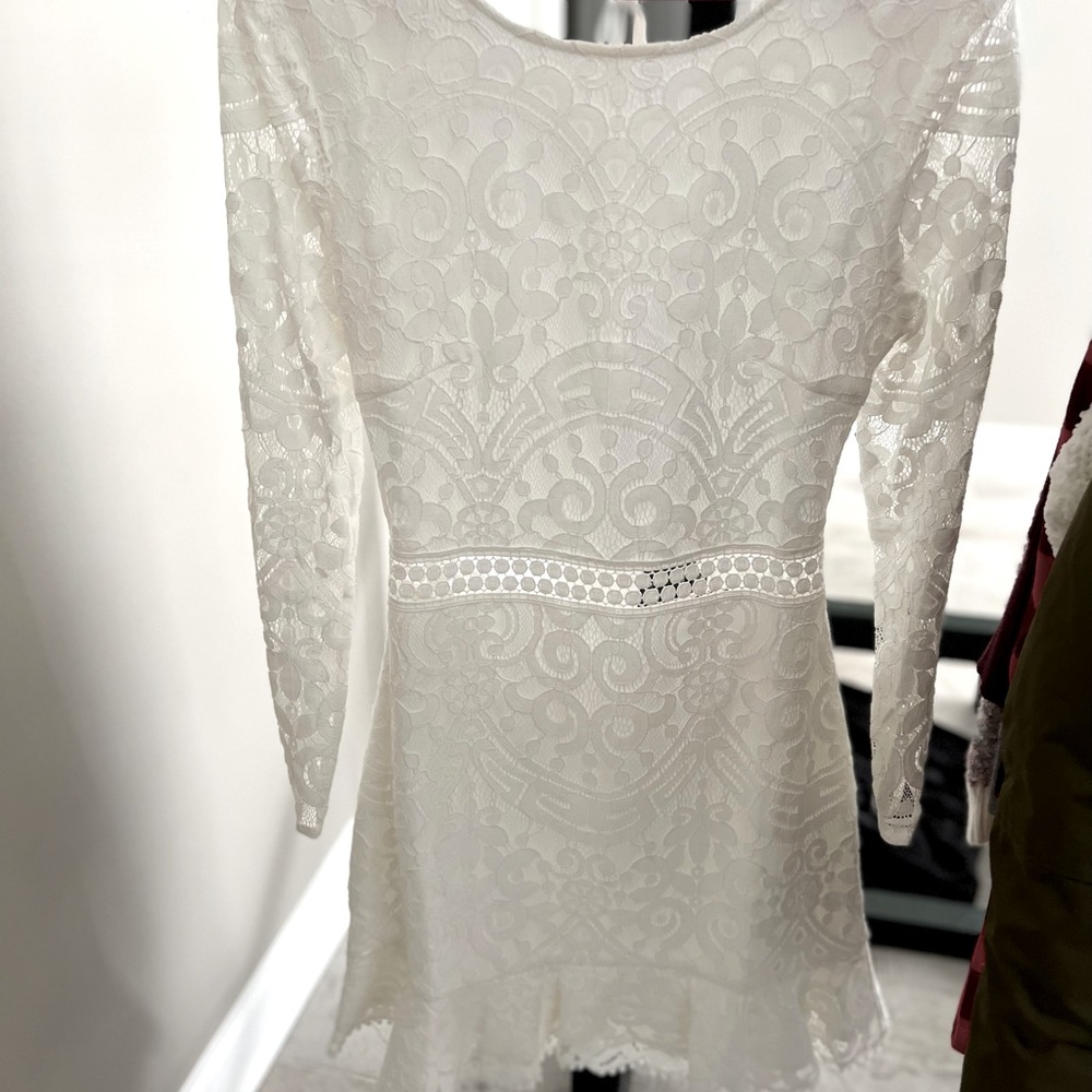 White dress! Comes down to right at knees. Size 8 Jaus Brand! Open back.